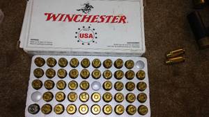 lot 33 image: Ammo Winchester 40, S and W. QTY.49