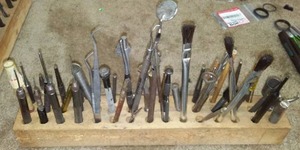 lot 96 image: Many small intricate hand tools.