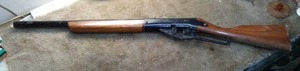 lot 135 image: Daisy BB gun. Wood and metal, safety on trigger, needs cleaning working, circa 70s.