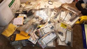 lot 461 image: Dozens of Weaver telescope mounts and hardware.