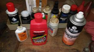 lot 396 image: Partial cans of Lubricants and gun products.