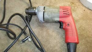 lot 477 image: Milwaukee corded Drill  working.  38 in., reversible, power lock.