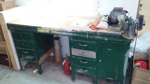 lot 485 image: Work bench with storage, light and grinder. 6 ft. x 2 ft x 3 ft. H.