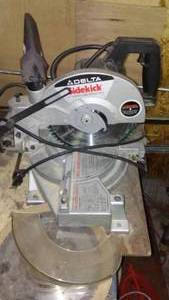 lot 499 image: Delta Sidekick Chop saw Compound Miter.