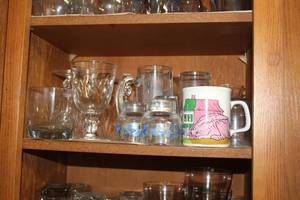 lot 804 image: Glassware (on middle shelf)  with Goblets, Water Glasses, Mugs, Beer Mug, Stem Glasses