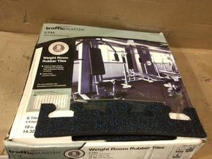 lot 70 image: TrafficMaster Black with Blue Flecks 18 in. x 18 in. x 0.3 in. Rubber GymWeight Room Flooring Tiles (14.32 sq. ft.) Customer Returns See Pictures