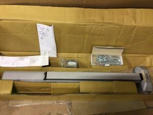 lot 97 image: Trans-Atlantic Rim Exit Device in Satin Stainless Steel Customer Returns See Pictures