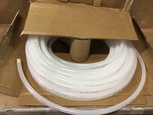 lot 13 image: UDP 58 in. O.D. x 12 in. I.D. x 100 ft. Natural Polyethylene Tubing Customer Returns See Pictures