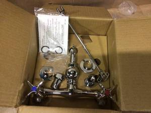 lot 18 image: Commander Wall Mount 2-Handle Bathroom Faucet in Polished Chrome with Cross Handles Customer Returns See Pictures