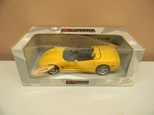 lot 20 image: 118 SCALE DIE-CAST - UT MODELS 15,000 YELLOW CORVETTE. NEW IN BOX. GREAT PIECE - SEE PICTURES.