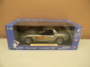 lot 26 image: 118 SCALE DIE-CAST - OLYMPIC TORCH RELAY 2001 CHEVROLET CORVETTE Z06 . NEW IN BOX. GREAT PIECE - SEE PICTURES.