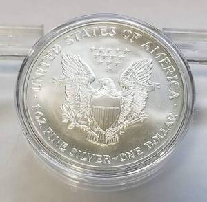 lot 46 image: 2003 AMERICAN SILVER EAGLE 1 TROY OZ. .999 FINE SILVER IN AIRTITE