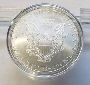 lot 56 image: 2010 AMERICAN SILVER EAGLE 1 TROY OZ .999 FINE SILVER IN AIRTITE