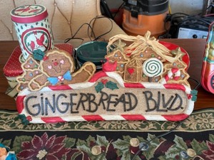 lot 27 image: Tote filled with Christmas decor, lights, snow figures, Rival Potpourri Crock, tins, table runner