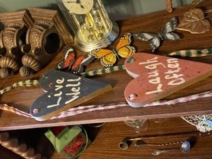 lot 135 image: Variety of decor, Clock, Wall Hangings, Metal Leaves, Wall Sconces, Wood Butterflies