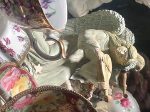 lot 227 image: Angels and Tea Cups on top Shelf of Curio