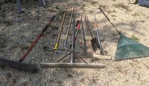 lot 354 image: Lot of Garden & Cleaning Tools Rake, Post Hole Digger, Mop, Broom, & More