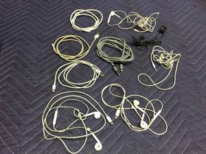 lot 118 image: iPhone Cords & Some Earbuds