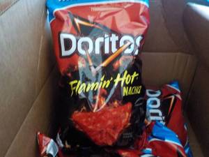 lot 318 image: Case of 4 Bags Dorito Flamin Hot N...