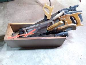 lot 103 image: Hand-Made Wooden Box Full of Hand Saws, Hack Saws, Blades, Sickle, Etc. 