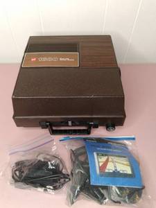 lot 127 image: Vintage GAF 1680 Projector in Case and Garmin Nuvi 205W