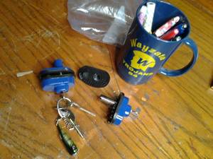 lot 255 image: Collection of Handgun Locks with Keys, Vintage 1984 Trojans Mug, and More 