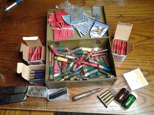 lot 257 image: Vintage Military Grade Ammunition Storage Box with .410 Shotgun Shells, Gun Cleaning Patches, Clips, Tools, and so Much More