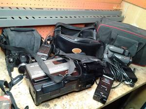 lot 297 image: Vintage Lot Containing Panasonic Omni-Movie Camcorder, Panasonic Digital Zoom Lens, Fujifilm Digital Camera, and Accessories 