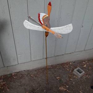 lot 181 image: Wooden Wind Vane Yard Ornament Cut and Painted in a Native Chief and Canoe 