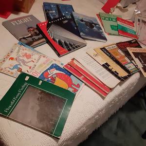 lot 357 image: Large Hardcover Books National Air and Space Station, Softcover Sheet Music, and More 