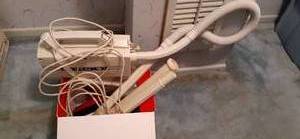 lot 138 image: Vintage Oreck XL Hand-Held Vacuum with Attachments