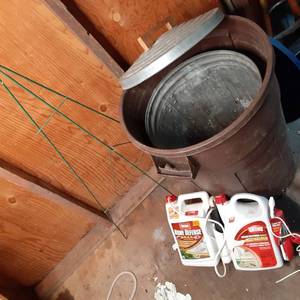lot 216 image: Lot of Ortho Home Defense Spray and (2) Garbage Cans Rubbermaid and Metal