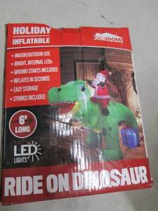 lot 26 image: holiday inflatable ride on dinosaur...