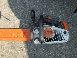 lot 6 image: Chain saw in a 5 gallon bucket, Sti...