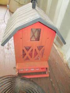 lot 29 image: bird feeder and tractor wind decora...