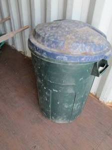 lot 49 image: Green garbage barrel with lid...