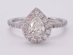 lot 1 image: Exquisite 1.13 Carat Pear Shaped VS High Grade Diamond Halo Estate Ring in 14k White Gold $6,250 Retail