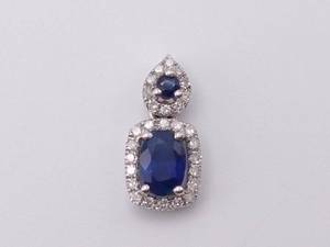 lot 33 image: Indigo Blue Sapphire and Diamond Halo Pendant in White Gold