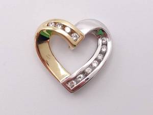 lot 44 image: Lovely Diamond Heart Pendant in Two-Toned 14k Gold
