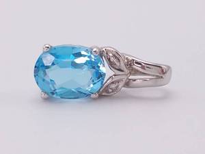lot 45 image: Aqua Blue Oval Topaz and Diamond Pendant in White Gold