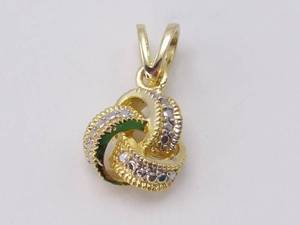 lot 62 image: Diamond and Gold Knot Pendant
