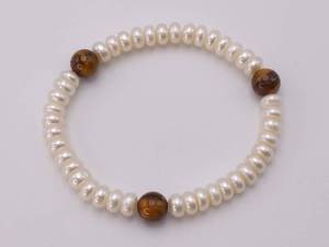 lot 67 image: Satin Button Pearl and Tiger Eye Estate Bracelet