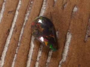 lot 55A image: 1.59 Carat Natural Colorful Black Welo Opal