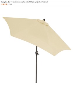 lot 23 image: Walker Edison Furniture Company Round Patio Umbrella Base in Antique Bronze & Hampton Bay 10 ft. Aluminum Market Auto Tilt Patio Umbrella in Oatmeal. See Pictures