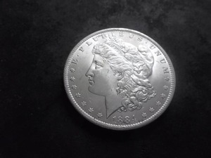 lot 20 image: 1884 O Morgan Silver Dollar