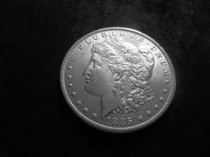 lot 21 image: 1885 O Morgan Silver Dollar