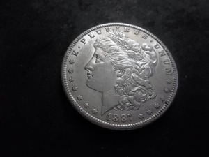 lot 24 image: 1887 S Morgan Silver Dollar