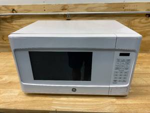 lot 24 image: GE 1.1 cu. ft. Countertop Microwave in White