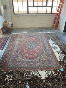 lot 56 image: Qum Hand-woven Wool Rug 10 ft 6 ft 3 in