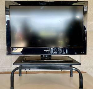 lot 8 image: Insigna 26 TV with Remote and Turnable Stand.  